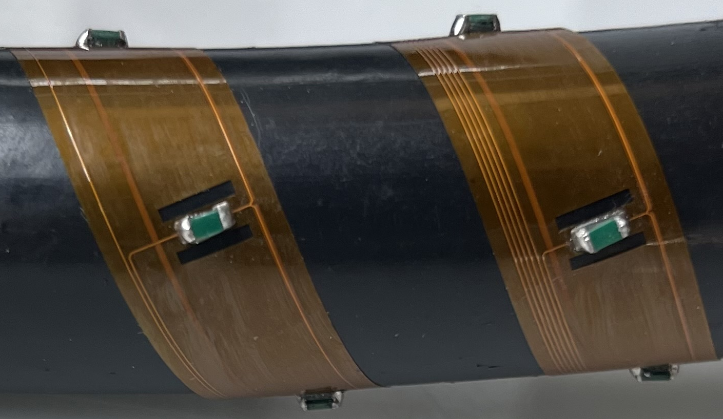 Kapton flex sensor strip wrapped around a pipe